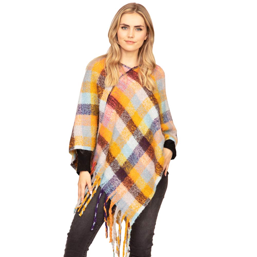 Purple Trendy Plaid Check Patterned Poncho, is absolutely beautiful wear to make you stand out and keep you warm and toasty in the cold weather or winter. It ensures your upper body keeps perfectly toasty when the temperatures drop. It's the timelessly beautiful poncho that gently nestles around the neck and feels exceptionally comfortable to wear. Attractive and eye-catchy fashion wear that will quickly become one of your favorite accessories for daily wear in winter.