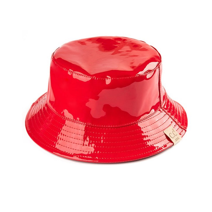 Red C.C Kids Shiny Solid Color Reflective Enamel Detailed Rain Bucket Hat; this rain hat is snug on the head and works well to keep rain off the head, out of the eyes, and also the back of the neck. Wear it to lend a modern liveliness above a raincoat on trans-seasonal days in the city. Perfect Gift for that fashion-forward friend