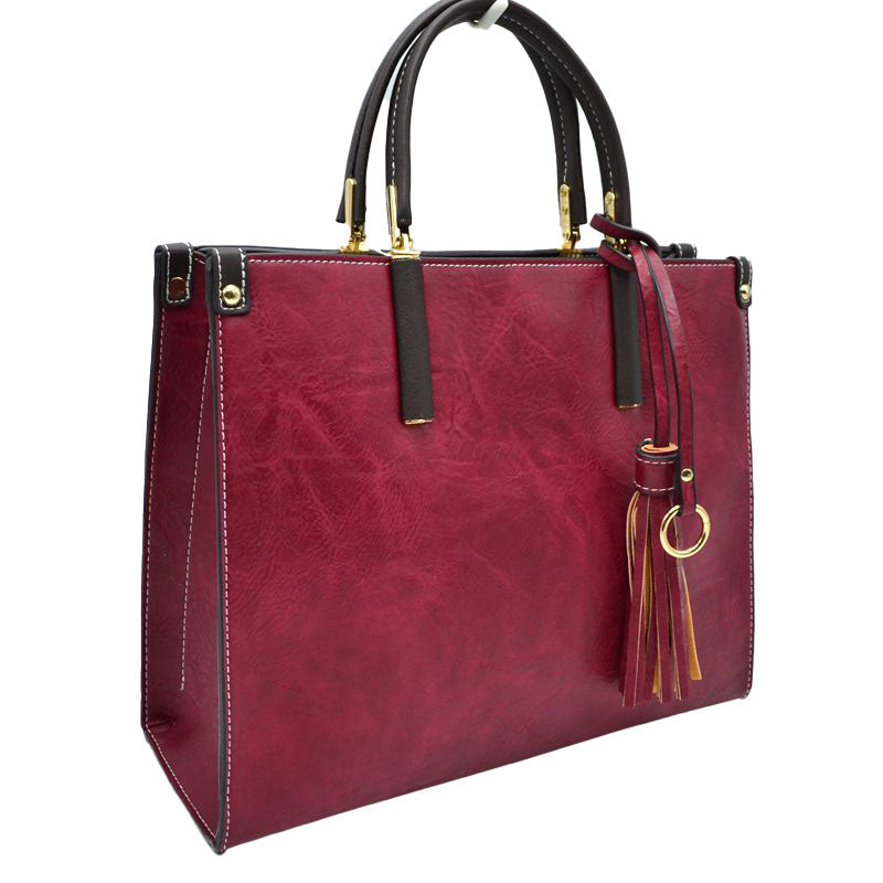 Red Large Shoulder Vegan Leather Tassel Handbag For Women. High quality Vegan Leather is a luxurious and durable, Stay organized in style with this square-shaped shopper tote bag that is fully two contrasting interior and exterior solid colors. This vegan leather handbag includes an on-trend removable tassel embellishment. Guaranteed, This will be your go-to handbag. 