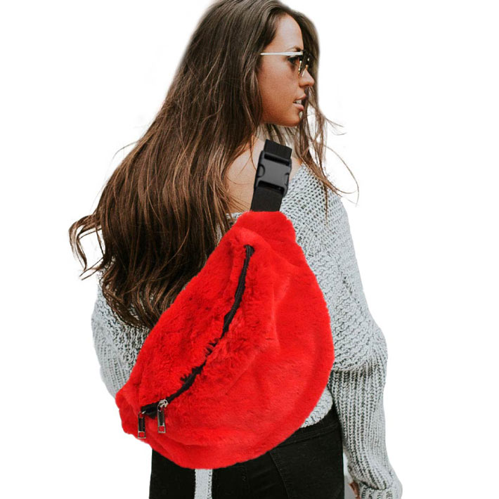 Red Solid Faux Fur Sling Bag, be the ultimate fashionista when carrying this Faux Fur Sling bag in style. It's great for carrying small and handy things. Keep your keys handy & ready for opening doors as soon as you arrive. The adjustable lightweight features room to carry what you need for those longer walks or trips. These fanny packs for women could keep all your documents, Phone, Travel, Money, Cards, keys, etc in one compact place, and comfortable within arm's reach.