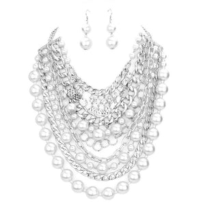 Rhodium White Stone Charm Chain Pearl Bib Necklace. These gorgeous bib necklace pieces will show your class in any special occasion. The elegance of these Stone goes unmatched, great for wearing at a party! stunning jewelry set will sparkle all night long making you shine like a diamond. Perfect jewelry to enhance your look. Awesome gift for birthday, Anniversary, Valentine’s Day or any special occasion.
