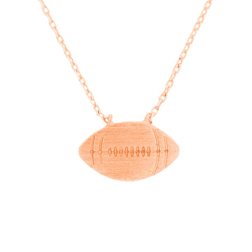 Rose Gold Metal Football Pendant Necklace, Add this simple sports-themed Pendant necklace to any look for a hint of bling! A delicately polished necklace that will enhance your look. It's versatile enough for wearing straight through the week. Coordinate with any ensemble from business casual to daily wear. The perfect addition to your attire and to every outfit. Wear this while cheering up your favorite team at the gallery to make you stand out from the crowd.