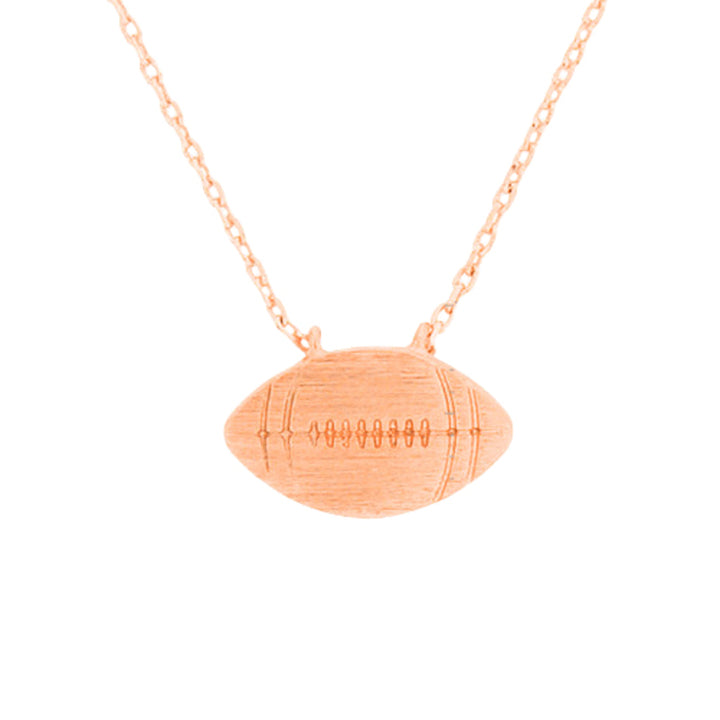 Rose Gold Metal Football Pendant Necklace, Add this simple sports-themed Pendant necklace to any look for a hint of bling! A delicately polished necklace that will enhance your look. It's versatile enough for wearing straight through the week. Coordinate with any ensemble from business casual to daily wear. The perfect addition to your attire and to every outfit. Wear this while cheering up your favorite team at the gallery to make you stand out from the crowd.