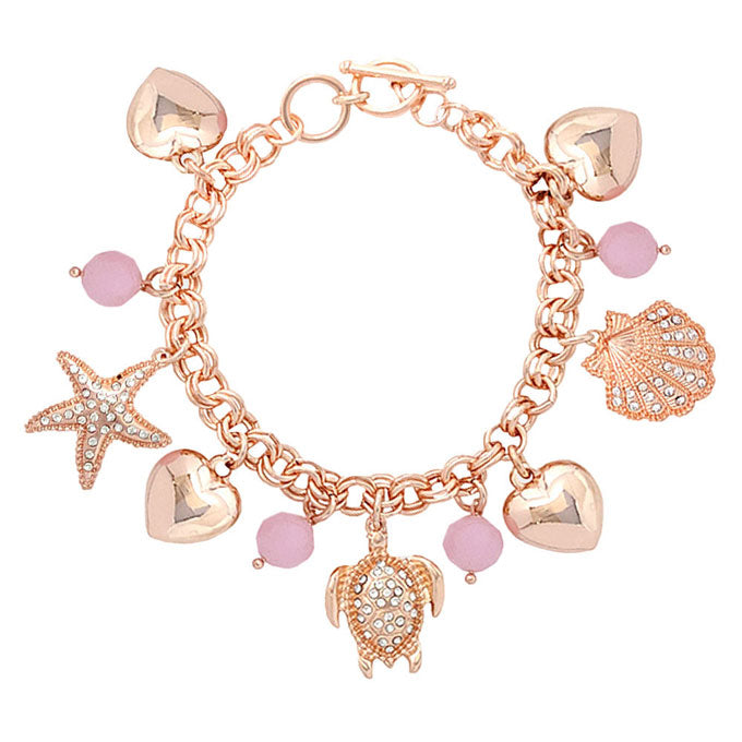 Rose Gold Rhinestone Embellished Starfish Turtle Shell Toggle Bracelet. This sea-themed bracelet features a parade of marine creatures for a fun, beachy vibe. With a polished finish and lifelike details. A timeless and traditional Holiday, Anniversary gift, Birthday gift, Valentine's Day gift for a woman or girl of any age.