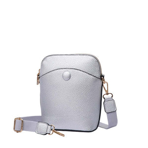 Silver Pebbled Faux Leather Mini Crossbody Bag, is a beautiful and useful addition to your attire that amps up your confidence and beauty to a greater extent. You can carry all of your handy stuff all together in this mini crossbody bag. The beautiful color variations make it cool and more attractive while carrying. The Crossbody bag comes in a Solid color that will go with any outfit in perfect style. 