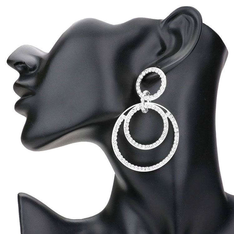 Silver Rhinestone Pave Double Open Circle Dangle Evening Earrings. These earrings Look as regal on the outside as you feel on the inside, feel absolutely flawless. Fabulous fashion and sleek style adds a pop of pretty color to your attire, match these dangle earrings with any ensemble for a polished look. pair perfectly with any ensemble from business casual, to night out on the town or a black-tie party.