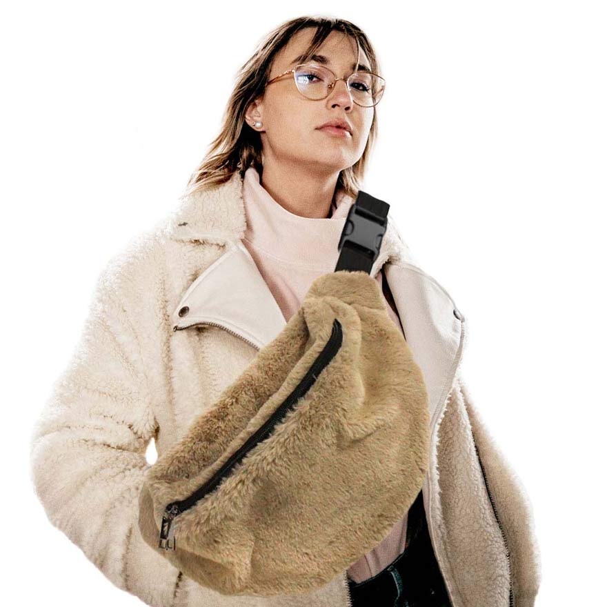 Tan Solid Faux Fur Sling Bag, be the ultimate fashionista when carrying this Faux Fur Sling bag in style. It's great for carrying small and handy things. Keep your keys handy & ready for opening doors as soon as you arrive. The adjustable lightweight features room to carry what you need for those longer walks or trips. These fanny packs for women could keep all your documents, Phone, Travel, Money, Cards, keys, etc in one compact place, and comfortable within arm's reach.