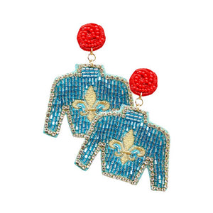 Turquoise Felt Back Seed Beaded Fleur de Lis Top Dangle Earrings, are beautifully crafted earrings that dangle on your earlobes with a perfect glow to make you stand out and show your unique and beautiful look everywhere. Put on a pop of color to complete your ensemble stylishly with these Fleur de Lis-themed earrings. Highlight your appearance and grasp everyone's eye at any place. Enhance your attire with these beautiful artisanal earrings to show off your fun trendsetting style.