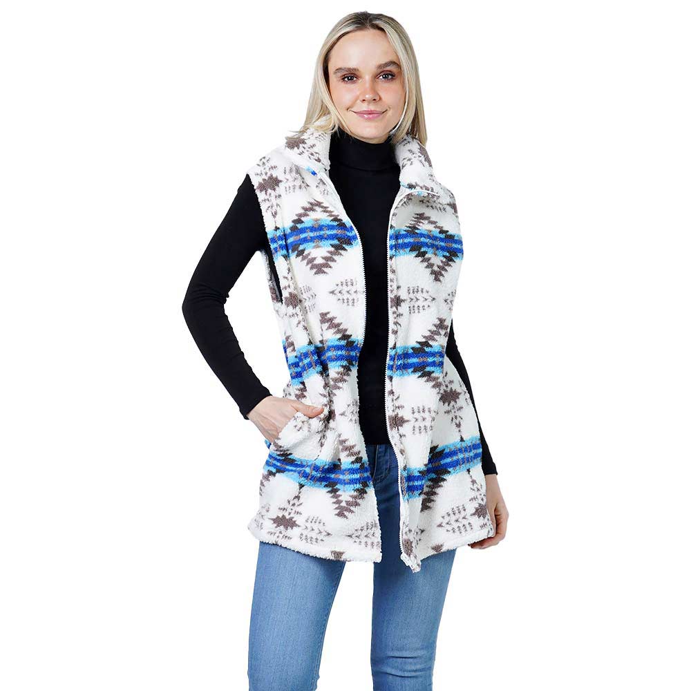 White Aztec Patterned Sherpa Fleece Pocket Vest, beautiful, soft feel and comfortable and the absolutely beautiful accessory for boosting up your gorgeousness and confidence with comfort. It will warm you up without all the weight and keeps you looking stylish! Great for traveling, layering is best so you can take off or put on easily. It is nice to feel stylish while being comfortable. You can throw it on over so many pieces elevating any casual outfit! 