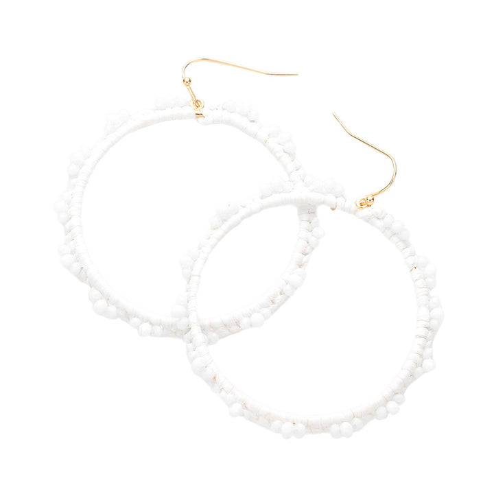 White Beaded Pointed Raffia Wrapped Open Circle Dangle Earrings, enhance your attire with these beautiful raffia-wrapped dangle earrings to show off your fun trendsetting style. It can be worn with any daily wear such as shirts, dresses, T-shirts, etc. These raffia open-circle dangle earrings will garner compliments all day long. Whether day or night, on vacation, or on a date, whether you're wearing a dress or a coat, these earrings will make you look more glamorous and beautiful. 