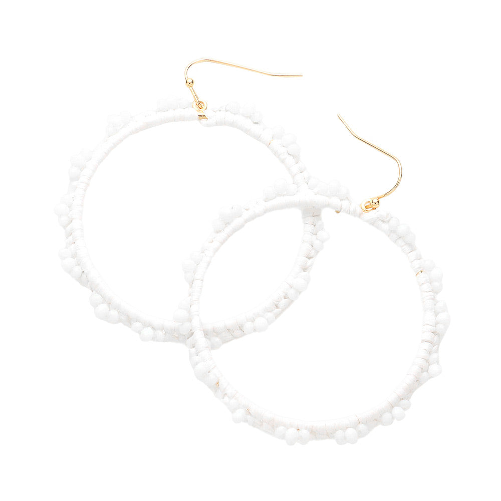 White Beaded Pointed Raffia Wrapped Open Circle Dangle Earrings, enhance your attire with these beautiful raffia-wrapped dangle earrings to show off your fun trendsetting style. It can be worn with any daily wear such as shirts, dresses, T-shirts, etc. These raffia open-circle dangle earrings will garner compliments all day long. Whether day or night, on vacation, or on a date, whether you're wearing a dress or a coat, these earrings will make you look more glamorous and beautiful. 