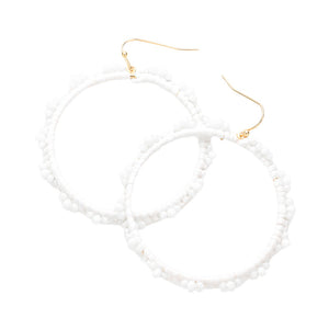 White Beaded Pointed Raffia Wrapped Open Circle Dangle Earrings, enhance your attire with these beautiful raffia-wrapped dangle earrings to show off your fun trendsetting style. It can be worn with any daily wear such as shirts, dresses, T-shirts, etc. These raffia open-circle dangle earrings will garner compliments all day long. Whether day or night, on vacation, or on a date, whether you're wearing a dress or a coat, these earrings will make you look more glamorous and beautiful. 