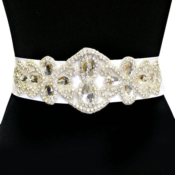 White Bridal Crystal & Bead Ribbon Belt. A timeless selection, this Crystal  Belt is exceptionally elegant, adding an exquisite detail to your wedding dress or tie it on your hair for a glamorous, beautiful self tie headband elevating your hairstyle on your super special day. Crystal applique is placed delicately on white organza ribbon, long enough to fit comfortably around your waist.
