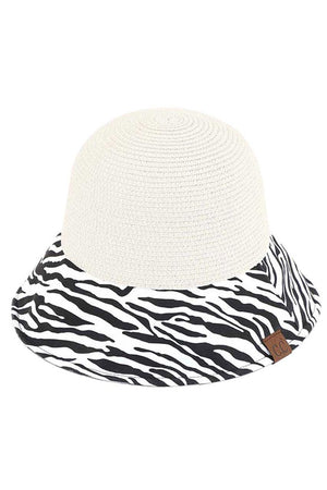 White C.C Zebra Print Cloche Straw Bucket Hat. Keep your styles on even when you are relaxing at the pool or playing at the beach. Large, comfortable, and perfect for keeping the sun off of your face, neck, and shoulders Perfect summer, beach accessory. Ideal for travelers who are on vacation or just spending some time in the great outdoors.