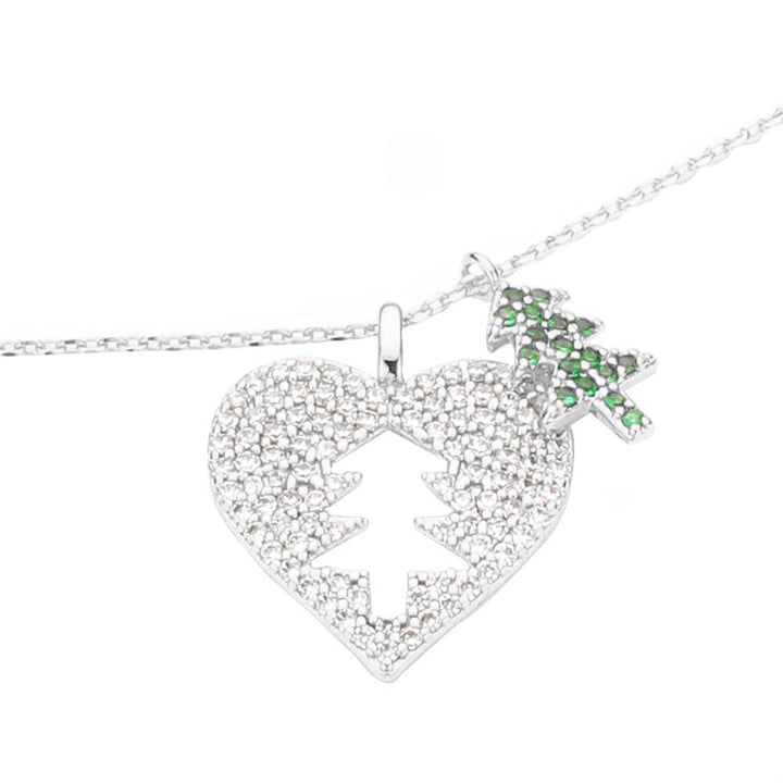 White Gold Dipped Cut Out Christmas Tree CZ Heart Pendant Necklace. Beautifully crafted design adds a gorgeous glow to any outfit. Jewelry that fits your lifestyle! Perfect Birthday Gift, Anniversary Gift, Mother's Day Gift, Anniversary Gift, Graduation Gift, Prom Jewelry, Just Because Gift, Thank you Gift.