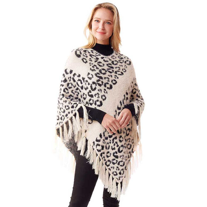 White Leopard Patterned Poncho, is a luxurious and trendy that enriches your beauty in a greater extent. It's super soft chic capelet which keeps you warm, toasty and so comfortable. You can throw it on over so many pieces elevating any casual outfit! Perfect Gift for Wife, Mom, Birthday, Holiday, Christmas, Anniversary, Fun Night Out. Stay trendy and comfortable!