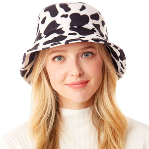 White Polyester One Size Cow Patterned Bucket Hat. Show your trendy side with this chic animal print hat. Have fun and look Stylish. Great for covering up when you are having a bad hair day, perfect for protecting you from the sun, rain, wind, snow, beach, pool, camping or any outdoor activities.