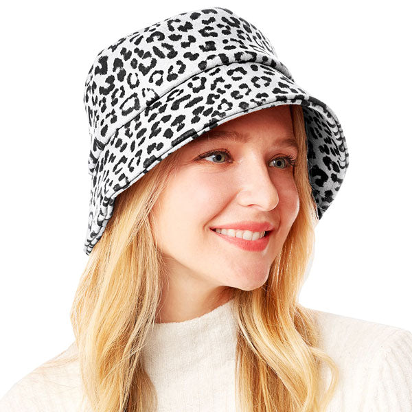 White Polyester One Size Leopard Patterned Bucket Hat. Show your trendy side with this chic animal print hat. Have fun and look Stylish. Great for covering up when you are having a bad hair day, perfect for protecting you from the sun, rain, wind, snow, beach, pool, camping or any outdoor activities.