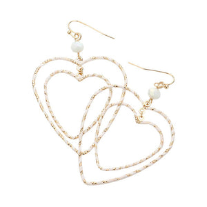 White Raffia Wrapped Double Open Heart Link Dangle Earrings, enhance your attire with these beautiful raffia-wrapped dangle earrings to show off your fun trendsetting style. It can be worn with any daily wear such as shirts, dresses, T-shirts, etc. These heart-link dangle earrings will garner compliments all day long. 