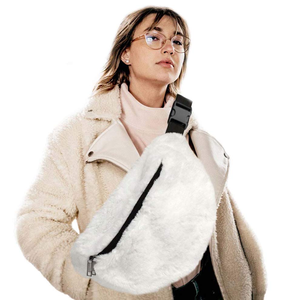 White Solid Faux Fur Sling Bag, be the ultimate fashionista when carrying this Faux Fur Sling bag in style. It's great for carrying small and handy things. Keep your keys handy & ready for opening doors as soon as you arrive. The adjustable lightweight features room to carry what you need for those longer walks or trips. These fanny packs for women could keep all your documents, Phone, Travel, Money, Cards, keys, etc in one compact place, and comfortable within arm's reach.