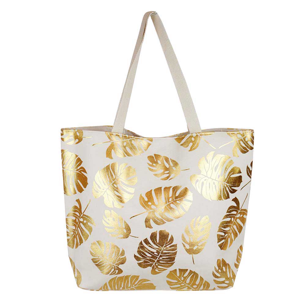 White Tropical Leaves Foil Beach Bag, Show your trendy side with this awesome Flower & Leaf beach tote bag. Spacious enough for carrying any and all of your seaside essentials. The soft rope straps really helps carrying this shoulder bag comfortably. Folds flat for easy packing. Perfect as a beach bag to carry foods, drinks, big beach blanket, towels, swimsuit, toys, flip flops, sun screen and more.