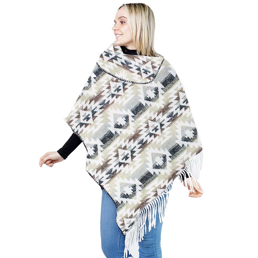 Gray Western Pattern Tassel Poncho, is beautifully designed with different attractive colors that brings out the luxe into your look. Can be paired with so many tops. It ensures your upper body stays perfectly toasty when the temperatures drop. It's Lightweight and Breathable Fabric, Comfortable to Wear. It gently nestles around the neck and feels exceptionally comfortable to wear.