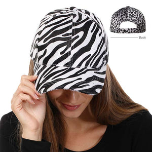 White Zebra Print Velcro Baseball Cap, is a fun cool vintage cap that is perfect for a bad hair day with an awesome look. You can pull your messy bun or high ponytail through. Fits perfectly and gives you a unique and confident look. Perfect to keep your hair away from your face while exercising, running, playing tennis, or just taking a walk outside. Stay smart in perfect style!