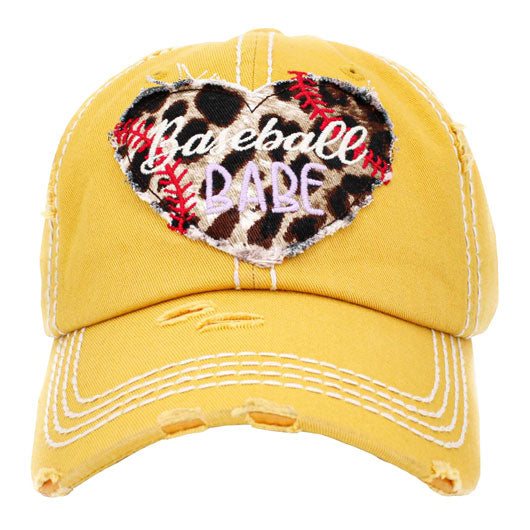 Yellow Baseball Babe Leopard Patterned Heart Vintage Baseball Cap. Fun cool message themed vintage baseball cap. Perfect for walks in sun, great for a bad hair day. The distressed frayed style with faded colour gives it an awesome vintage look. Soft textured, embroidered message with fun statement will become your favourite cap.