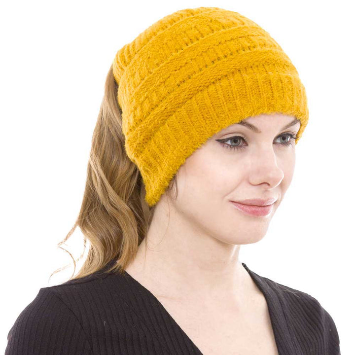 Yellow Cable Knit Ponytail Beanie Hat, Perfect for pulling your messy bun or high ponytail, while keeping ears warm. Great to wear while exercising in cold weather to keep your hair up and your head warm. It's the autumnal touch you need to finish your outfit in style. The cable knit hat can be used on your working day, You can also wear it in outdoor sports: running, biking etc. Awesome winter gift accessory!