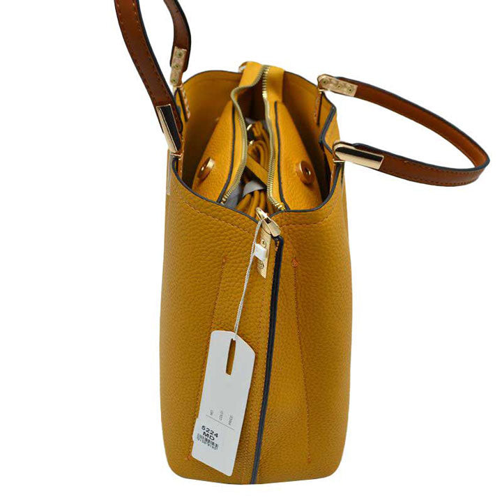 Yellow Simpler Times Bucket Crossbody Bags For Women. A great everyday casual shoulder bag composed of Faux leather. A simple design with subtle gold hardware details on the closure. Magnetic snap closure for an inner zipper pouch opening spacious to hold your phone, wallet, and other essentials securely.