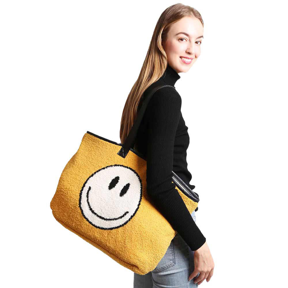 Yellow Smile Face Tote Bag, Add a unique, beautiful, and trendy style to your look with this smile face tote bag for women. This fashionable handbag has a casual-cool silhouette that is structured, stylish, and ultra-comfortable. An adjustable strap and top handle elevate the structured style of this handbag. This spacious handbag features a roomy interior to hold all your essentials. It’s safe, secure, and great for travel. 