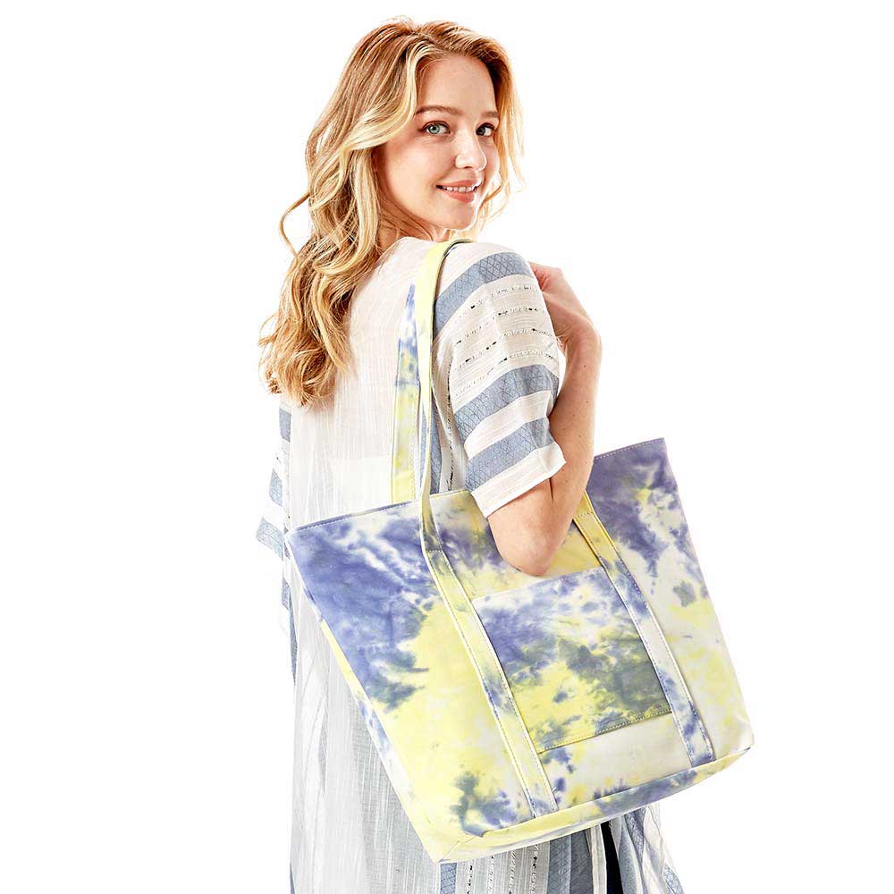 Yellow Tie Dye Tote Bag, this bright tote bag is the perfect accessory. Whether you are out shopping, going to the pool or beach, this Tie Dye Tote bag is the perfect accessory. Spacious enough for carrying any and all of your outside essentials. The soft strap really helps carrying this tie dye shoulder bag comfortably.