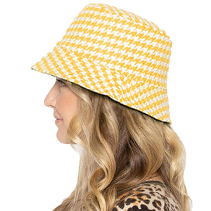 Yellow Polyester Houndstooth Patterned Bucket Hat, this bucket hat doubles as a rain hat and is snug on the head and stays on well. It will work well to keep the rain off the head and out of the eyes and also the back of the neck. Wear it to lend a modern liveliness above a raincoat on trans-seasonal days in the city.